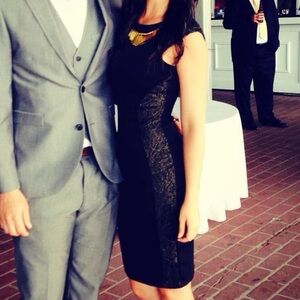 Black cocktail dress with gold details